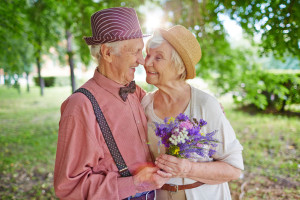 Happy elderly couple in love enjoying summer day together